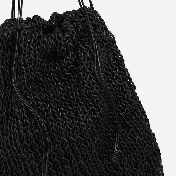 THE POUCH BAG in black — detail of knitted leather texture and drawstring | PROVE'M WRONG