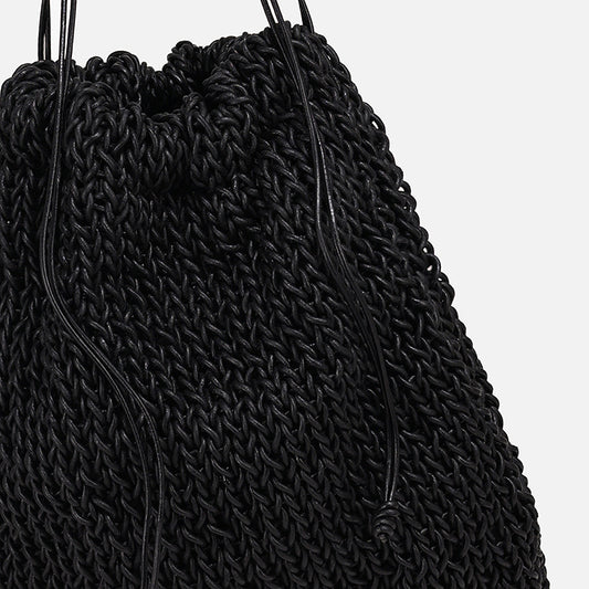 THE POUCH BAG in black — detail of knitted leather texture and drawstring | PROVE'M WRONG