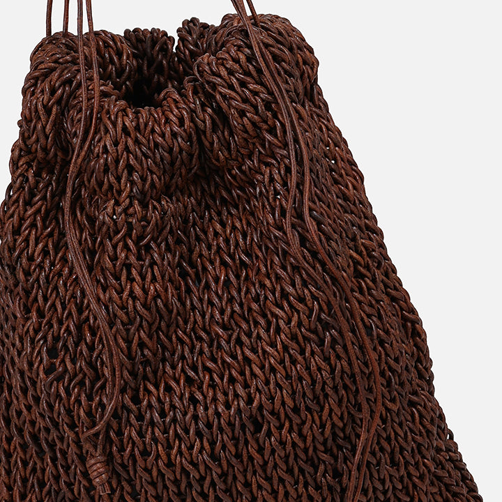 THE POUCH BAG in brown — detail of knitted leather texture and drawstring | PROVE'M WRONG