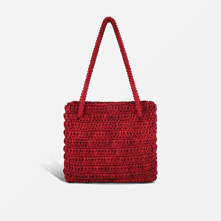 THE STAPLE BAG in red — hand-crocheted leather shoulder tote by PROVE'M WRONG, front view