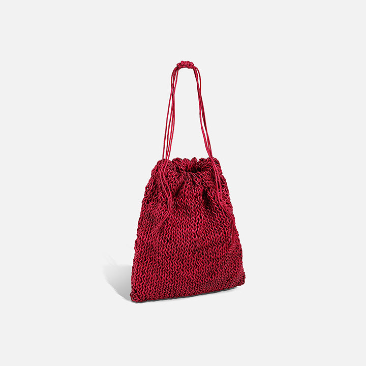 THE POUCH BAG in cherry red — side view of hand-knitted leather pouch | PROVE'M WRONG