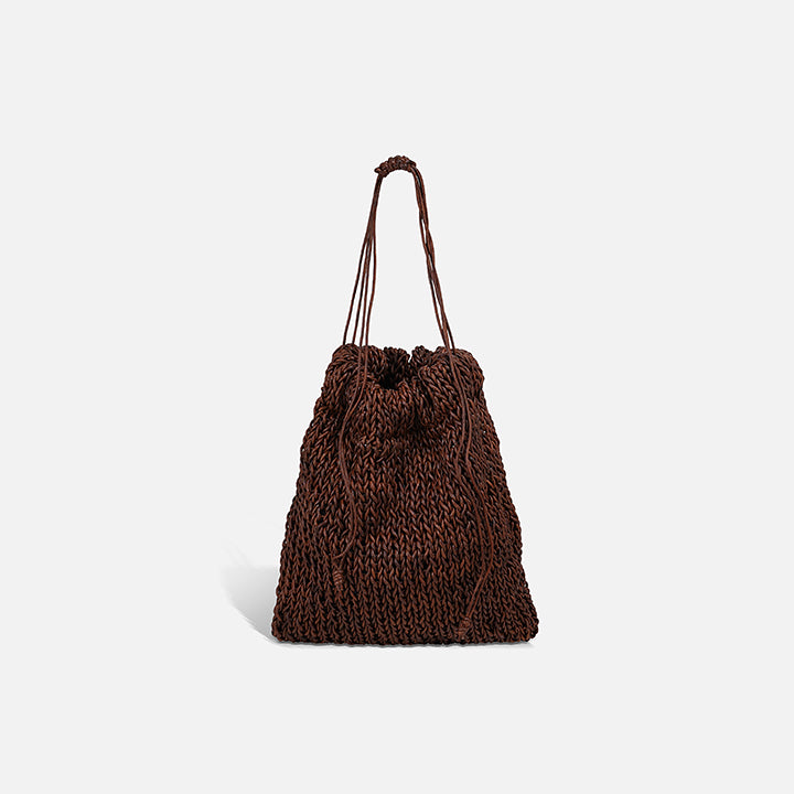 THE POUCH BAG in brown — hand-knitted leather pouch with drawstring close by PROVE'M WRONG, front view